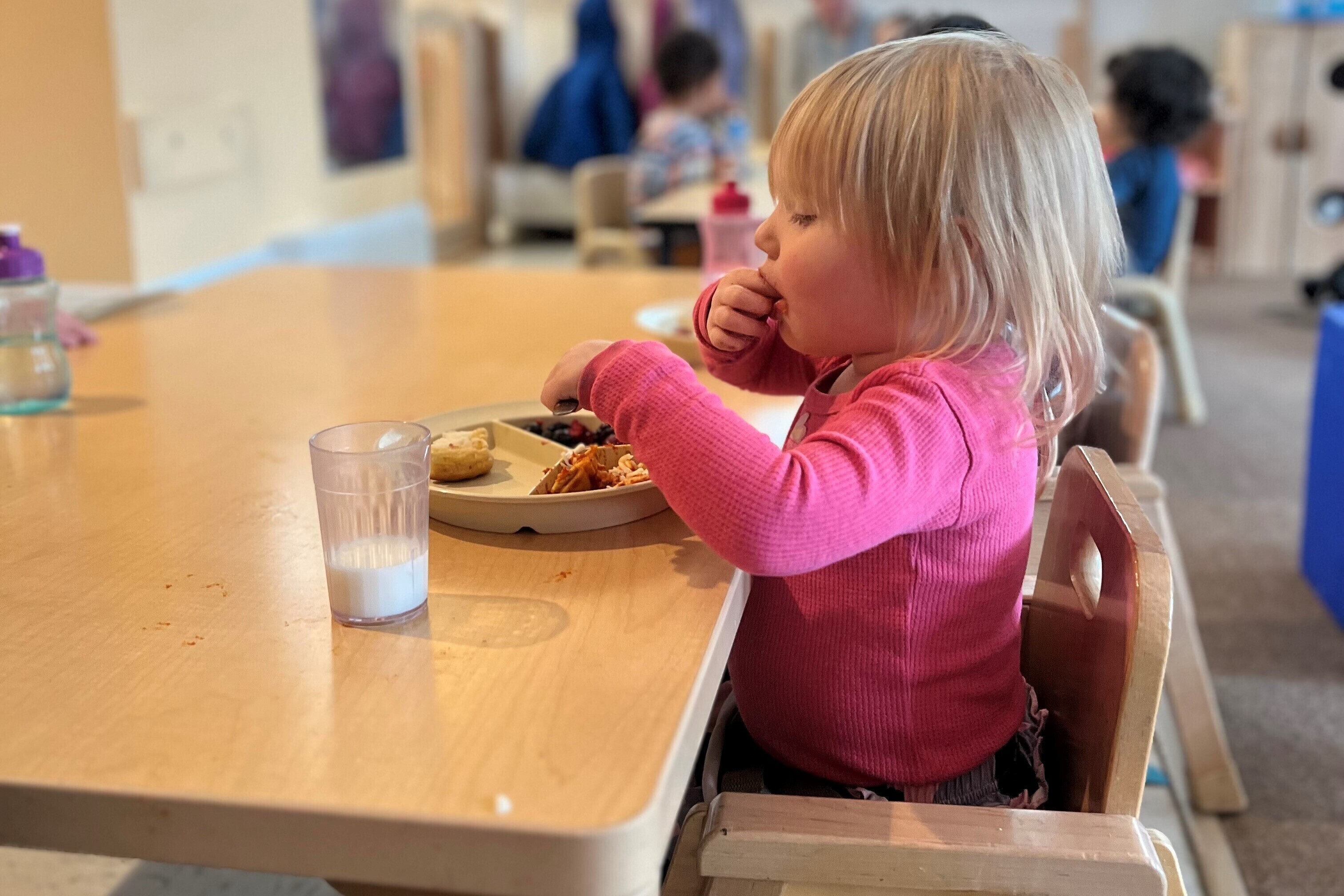 Small child eating at a table